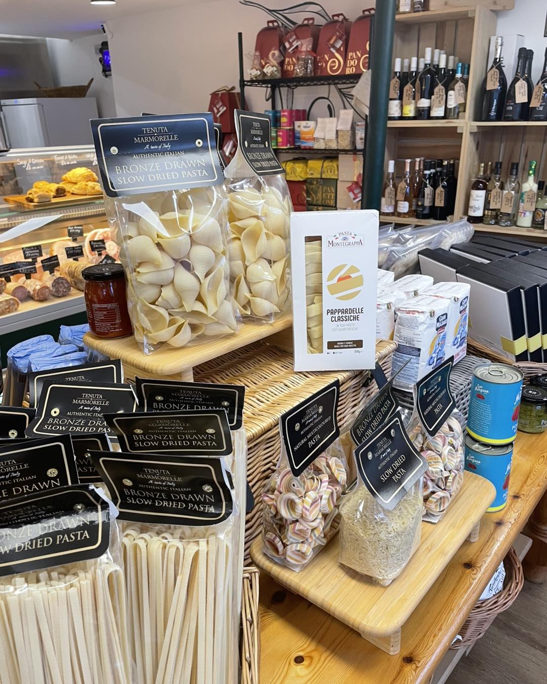 Bronze-drawn Italian pasta and pantry shelves at the deli