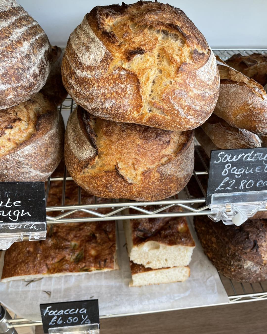 Freshly baked sourdough loaves on the deli counter